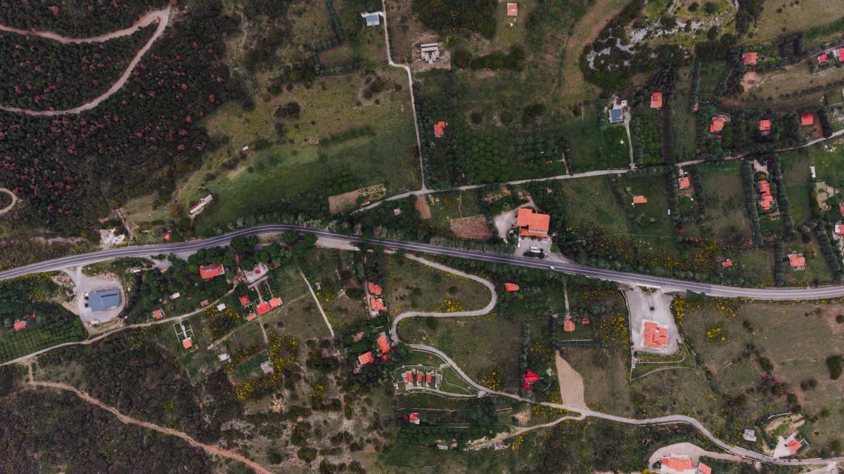 Aerial landscape of rural countryside with road and fields in Delphi, Greece.